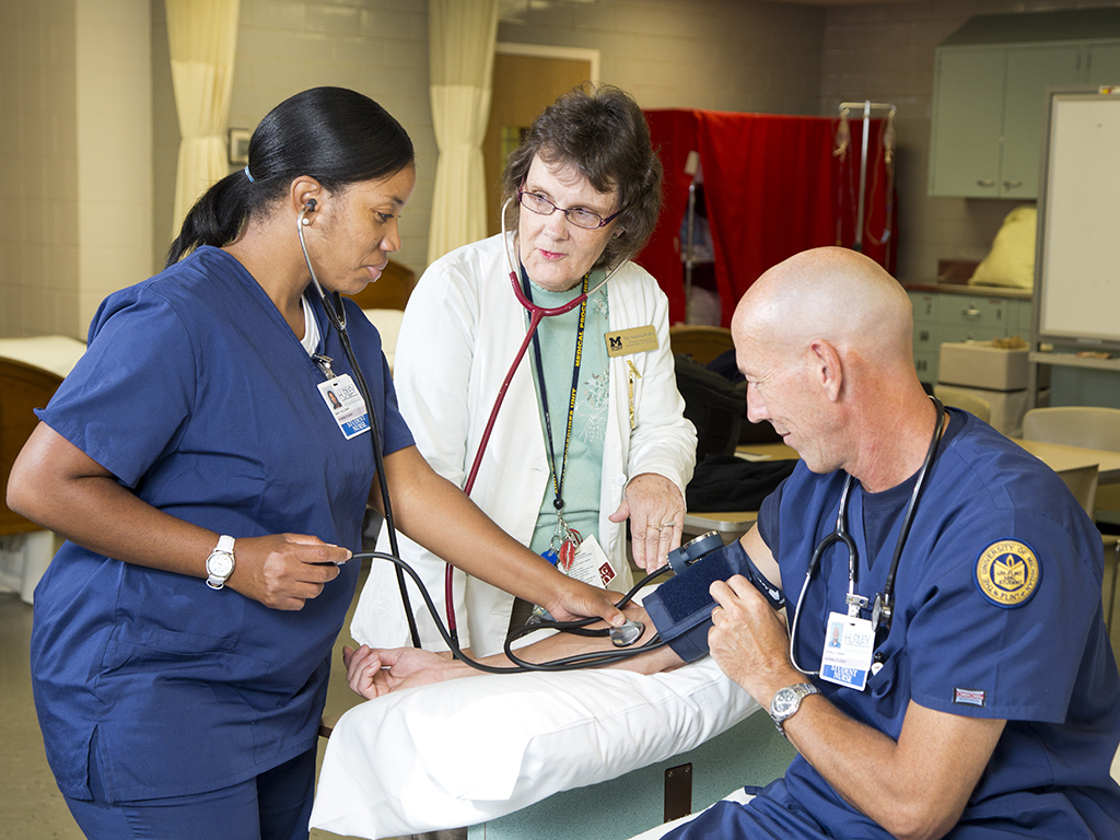 Nurse checking blood pressure 